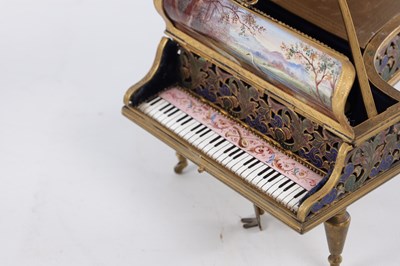 Lot 786 - A LATE 19TH CENTURY VIENNESE ENAMEL AND GILT BRASS GRAND PIANO FORM MUSIC BOX