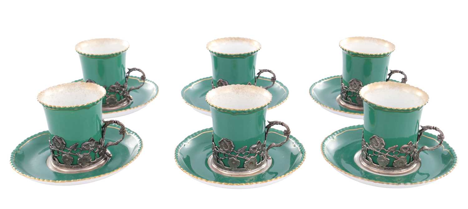 Lot 34 - A SET OF SIX ROYAL WORCESTER CERAMIC AND SILVER MOUNTED CUPS AND SAUCERS