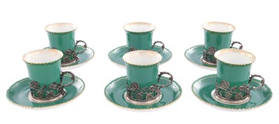 Lot 34 - A SET OF SIX ROYAL WORCESTER CERAMIC AND SILVER MOUNTED CUPS AND SAUCERS