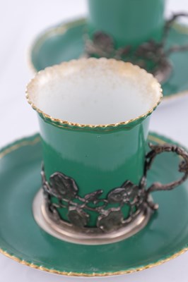 Lot 34 - A SET OF SIX ROYAL WORCESTER CERAMIC AND SILVER MOUNTED CUPS AND SAUCERS
