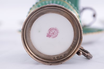 Lot 34 - A SET OF SIX ROYAL WORCESTER CERAMIC AND SILVER MOUNTED CUPS AND SAUCERS