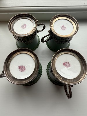 Lot 34 - A SET OF SIX ROYAL WORCESTER CERAMIC AND SILVER MOUNTED CUPS AND SAUCERS