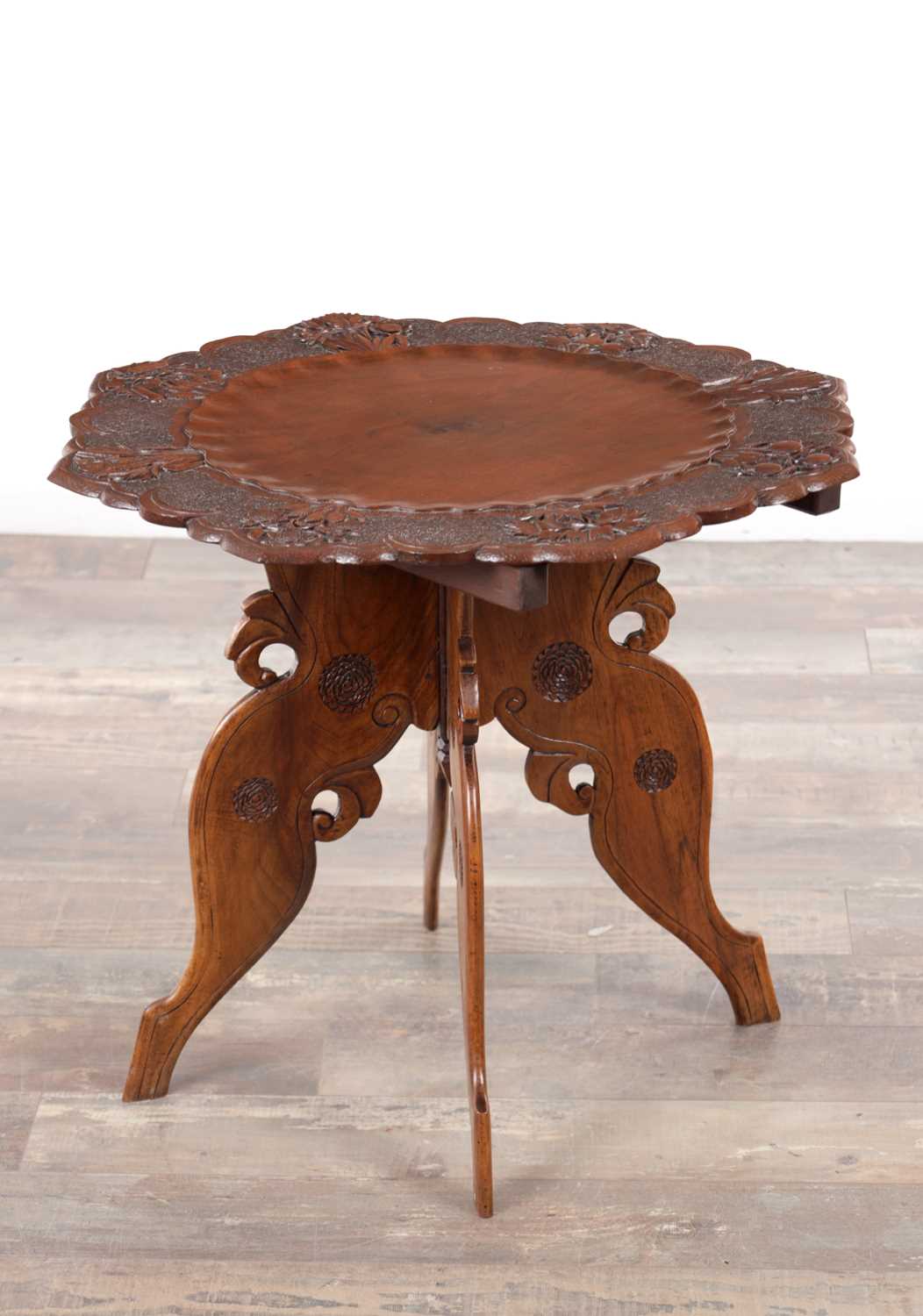 Lot 430 - A 19TH CENTURY ANGLO-INDIAN CARVED HARDWOOD FOLDING SIDE TABLE
