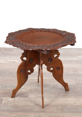 Lot 430 - A 19TH CENTURY ANGLO-INDIAN CARVED HARDWOOD FOLDING SIDE TABLE