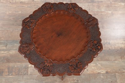 Lot 430 - A 19TH CENTURY ANGLO-INDIAN CARVED HARDWOOD FOLDING SIDE TABLE