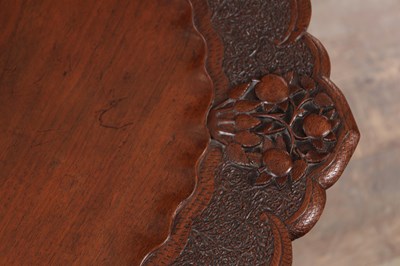 Lot 430 - A 19TH CENTURY ANGLO-INDIAN CARVED HARDWOOD FOLDING SIDE TABLE