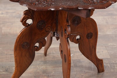 Lot 430 - A 19TH CENTURY ANGLO-INDIAN CARVED HARDWOOD FOLDING SIDE TABLE