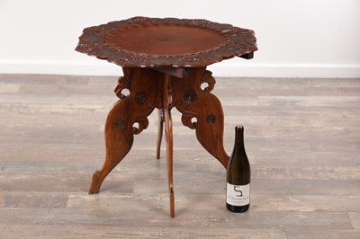 Lot 430 - A 19TH CENTURY ANGLO-INDIAN CARVED HARDWOOD FOLDING SIDE TABLE