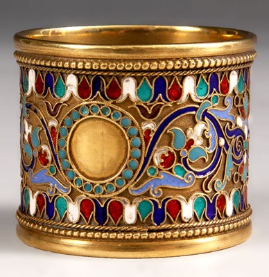 Lot 187 - An Enamelled gilt Metal Russian SERVIETTE RING...