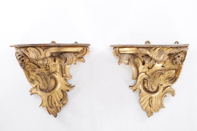 Lot 589 - A PAIR OF 18TH CENTURY CARVED GILTWOOD WALL BRACKETS