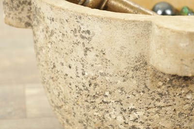 Lot 496 - A CARVED STONE MORTAR AND BELL METAL PESTLE