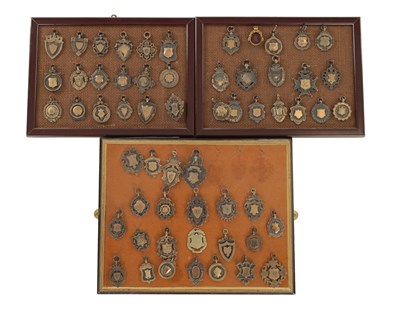 Lot 1251 - A COLLECTION OF FIFTY-EIGHT SILVER AND METAL POCKET WATCH FOBS