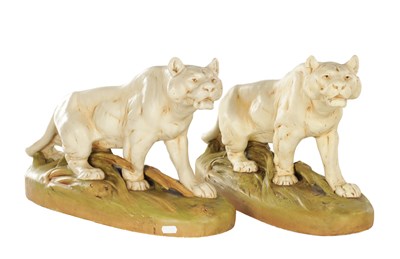 Lot 18 - OTTO JARL (1865-1915). A COLLECTION OF TWO ART NOUVEAU LARGE PORCELAIN ROYAL DUX LIONESSES