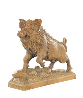 Lot 781 - AN EARLY 20TH CENTURY BLACK FOREST CARVED LINDEN WOOD SCULPTURE OF A BOAR