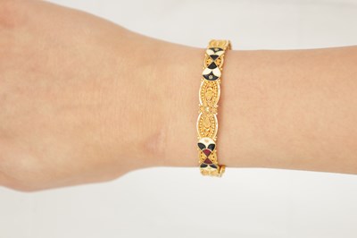 Lot 303 - A 21CT GOLD AND ENAMEL BRACELET