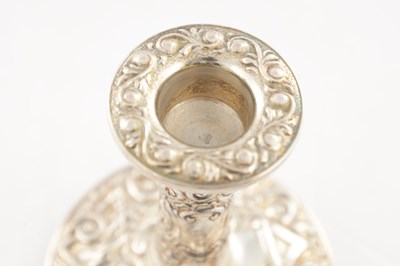 Lot 135 - A PAIR OF 20TH CENTURY SILVER CANDLE STICKS