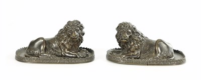 Lot 948 - A PAIR OF REGENCY PATINATED BRONZE LION PAPER WEIGHTS