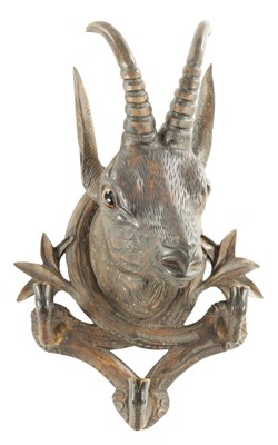 Lot 804 - A LATE 19TH CENTURY CARVED BLACK FOREST COAT RACK