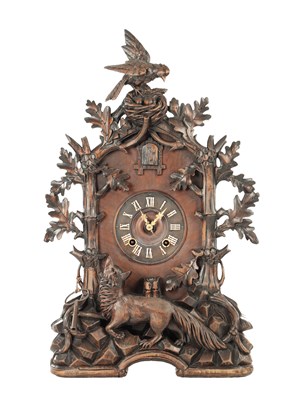 Lot 1411 - A 19TH CENTURY BLACK FOREST CARVED LINDEN WOOD CUCKOO MANTEL CLOCK