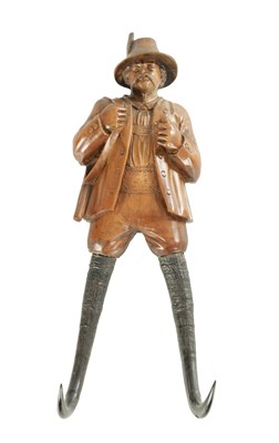 Lot 833 - A 19TH CENTURY BLACK FOREST CARVED FRUITWOOD COAT HOOK