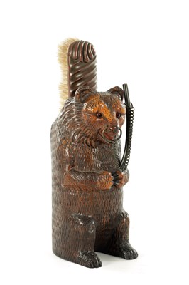 Lot 803 - A 19TH CENTURY BLACK FOREST CARVED BRUSH STAND