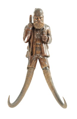 Lot 825 - A 19TH CENTURY BLACK FOREST COAT HOOK