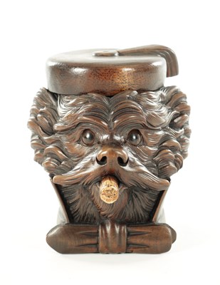 Lot 771 - A 19TH CENTURY CARVED LINDENWOOD BLACK FOREST TOBACCO JAR