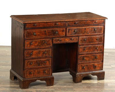 Lot 1461 - A RARE GEORGE I FIGURED WALNUT AND PEWTER INLAID KNEEHOLE DESK IN THE MANNER OF COXED AND WOSTER