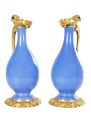 Lot 70 - A LARGE PAIR OF 19TH CENTURY ORMOLU MOUNTED BLUE PORCELAIN BOTTLE VASES