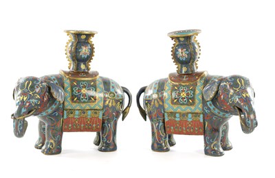 Lot 527 - A PAIR OF 19TH CENTURY CHINESE CLOISONNE ELEPHANT CANDLESTICKS