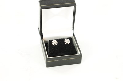 Lot 225 - A PAIR OF LADY'S PLATINUM SOLITAIRE DIAMOND EARRINGS