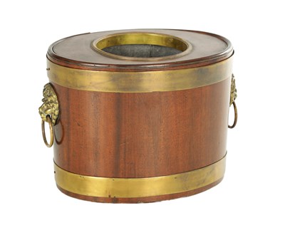Lot 786 - AN EARLY 19TH CENTURY BRASS-BOUND MAHOGANY OVAL TABLE-TOP BOTTLE COOLER CIRCA 1820