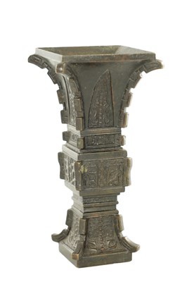 Lot 506 - A 19TH CENTURY CHINESE ARCHAISTIC BRONZE 'GU' VASE