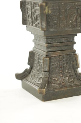 Lot 506 - A 19TH CENTURY CHINESE ARCHAISTIC BRONZE 'GU' VASE