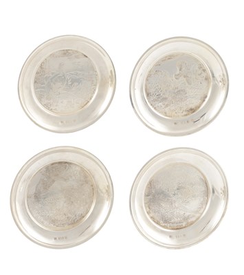 Lot 155 - A SET OF FOUR IRISH SILVER GAME BIRD COASTERS