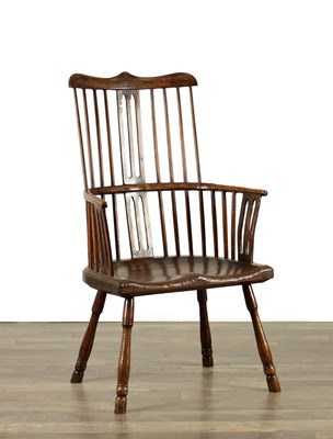 Lot 1563 - AN OVER-SIZED 18TH CENTURY ASH AND ELM COMB BACK WINDSOR CHAIR