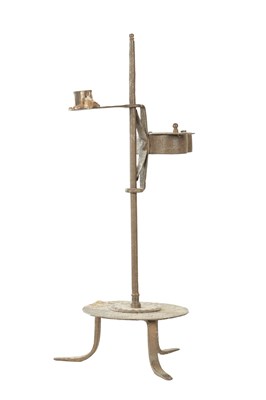 Lot 928 - AN EARLY 18TH CENTURY IRON ADJUSTABLE BETTY LAMP AND CANDLE HOLDER
