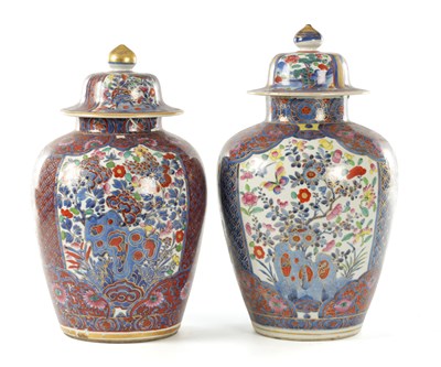 Lot 477 - A NEAR PAIR OF 18TH CENTURY CHINESE BLUE AND WHITE BULBOUS VASES AND COVERS LATER DECORATED
