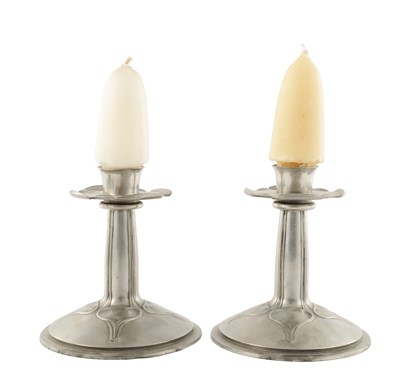 Lot 984 - A PAIR OF EARLY 20TH CENTURY TUDRIC PEWTER CANDLESTICKS IN THE MANNER OF ARCHIBALD KNOX