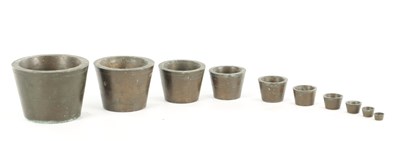 Lot 1157 - AN UNUSUAL SET OF TEN 19TH CENTURY BRONZE WEIGHTS