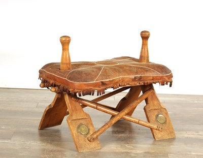 Lot 494 - A 20TH CENTURY EASTERN HARDWOOD AND LEATHER CAMEL SADDLE