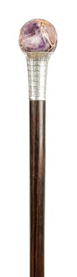 Lot 843 - AN EARLY 20TH CENTURY SILVER MOUNTED WALKING CANE WITH AMETHYST HANDLE