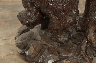 Lot 818 - A RARE 19TH CENTURY CARVED LINDEN WOOD BLACK FOREST STICK STAND FORMED A STANDING DOG