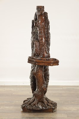 Lot 818 - A RARE 19TH CENTURY CARVED LINDEN WOOD BLACK FOREST STICK STAND FORMED A STANDING DOG