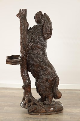 Lot 818 - A RARE 19TH CENTURY CARVED LINDEN WOOD BLACK FOREST STICK STAND FORMED A STANDING DOG