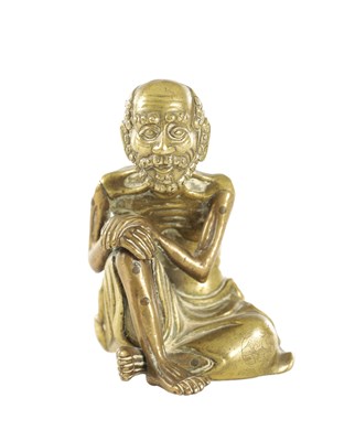 Lot 431 - AN EARLY CHINESE BRONZE BUDDHA FIGURE OF A SEATED LUOHUN
