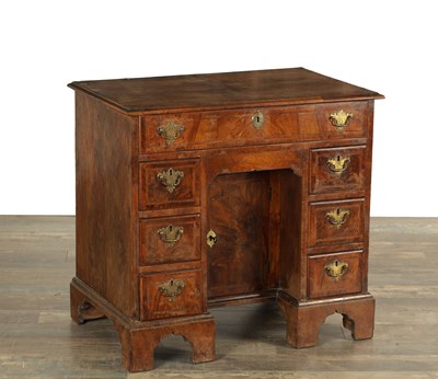 Lot 1605 - AN EARLY 18TH CENTURY FIGURED WALNUT AND HERRING-BANDED KNEEHOLE DESK