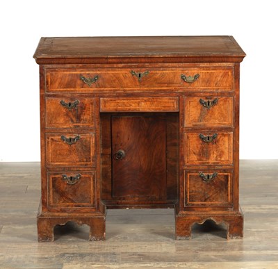 Lot 1571 - AN EARLY 18TH CENTURY FIGURED WALNUT AND HERRING-BANDED KNEEHOLE DESK