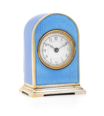 Lot 1438 - A EARLY 20TH CENTURY SILVER-GILT AND BLUE GUILLOCHE ENAMEL TRAVELLING TIMEPIECE