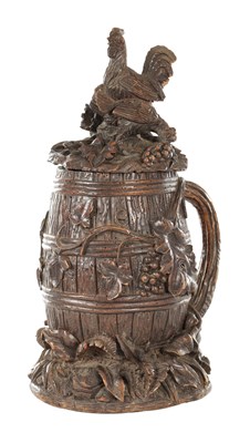 Lot 811 - A 19TH CENTURY CARVED BLACK FOREST TABACCO JAR